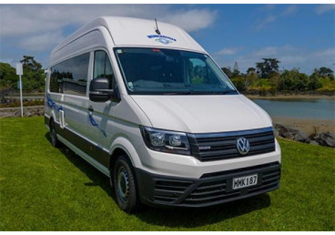 Koru 4 Freedom Campervan has been designed for freedom camping off the grid with up to four adults. It is beyond doubt competing to be New Zealands best non-composite 4 person motorhome hire in New Zealand.
The VW Crafter has been upgraded to a 130KW engine and offers a range of safety features such as side wind compensation, autonomous emergency braking, collision warning assist and active 360° sensor side protect. The Crafter complies with the EU6 emission standard and is extremely economical at 10l/100km.
The 4-seat front configuration enables all passengers to travel together in close vicinity. It also serves as an area to socialise or have meals whilst the rear beds are set up. Tinted windows improve privacy and support good sleep in combination with quality curtains.
Standard features include an on-board touch screen with reversing camera, a pull-out pantry, a full bathroom (with handbasin), a 130l fridge, decent kitchen bench space, a 3-burner gas cooker with sink and ample storage.
In line with previous productions in the freedom range, we have added a powerful 280-watt MPPT controlled solar system. Two quality deep cycle batteries provide a solid 2.88 kilowatt hours or 240 amp hours of in-house battery storage. The combination of good solar and sufficient power storage allows you to camp independently for long periods at a time. The hot water is produced by an instantaneous gas system which will deliver hot water on demand as needed.
The vehicle is equipped with USB and 12V power supplies to allow modern ways of charging your handheld devices. The combination of energy efficient appliances and LED lighting results in extremely good energy performance whilst freedom camping.
Additionally, we have installed a 2.2KW diesel heating system. This allows for more energy storage and reduces the need to refill LPG gas bottles. The diesel heating system is connected to the 75l diesel tank and uses an average of 300ml per hour of heating.
Overall, this vehicle offers safe transport at little fuel expense, designed for independent camping away from costly campgrounds.
This vehicle is certified self-contained in accordance with the Plumbers, Gas and Drain Fitters (Self-Contained Vehicles) Regulations 2023 (the new rules - green warrant).